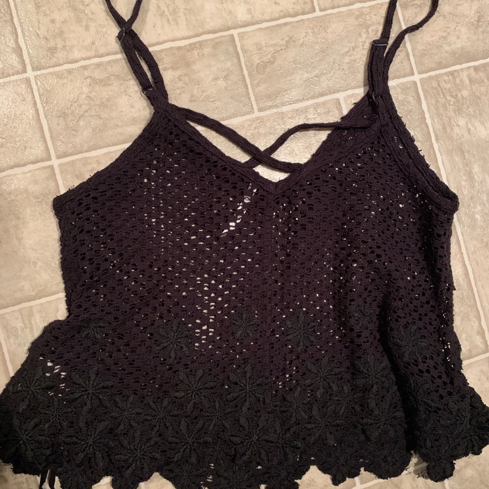 Free people black crochet tank top size
XS with floral detail
